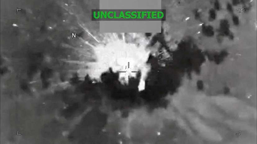 An explosion occurs on a vessel during what the U.S. military says was a kinetic strike on a suspected drug trafficking vessel in the Caribbean