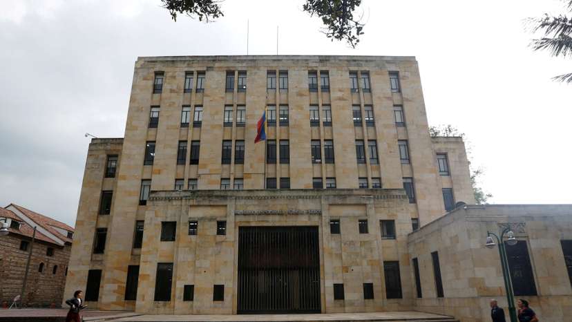 FILE PHOTO: Poeple walk in front of Colombian Ministry of Finance and Public Credit in Bogota