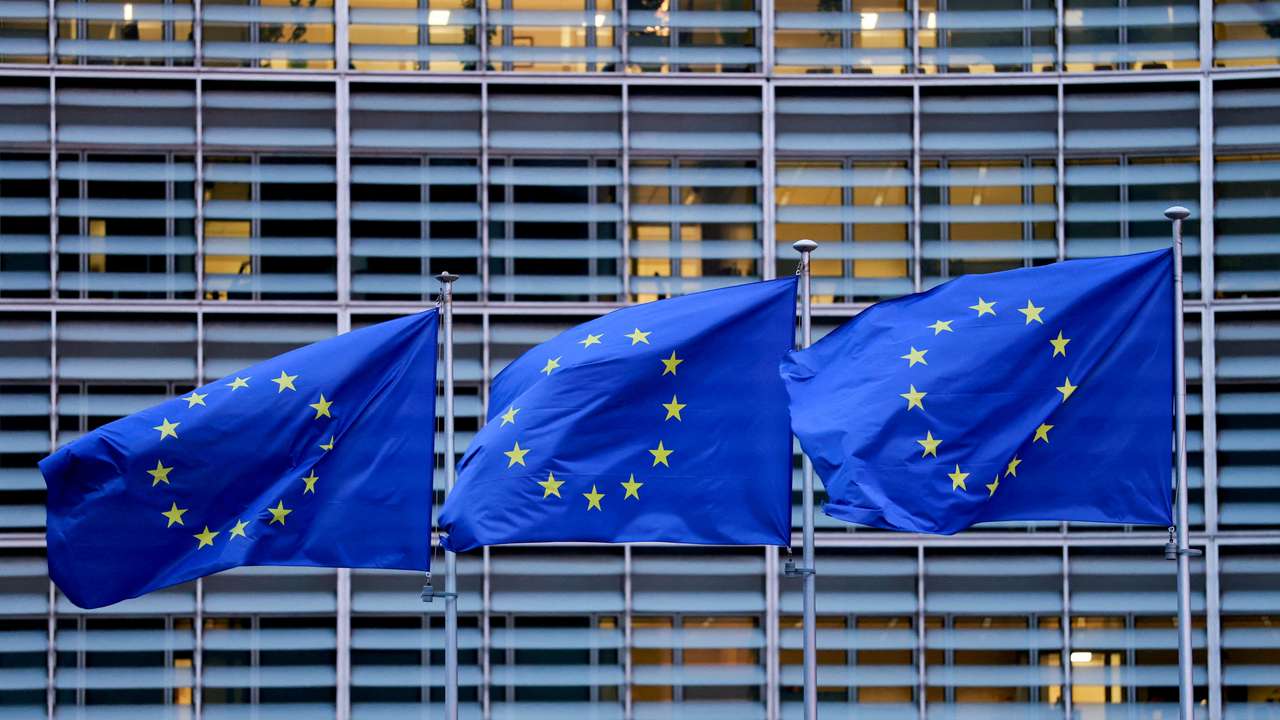 FILE PHOTO: European Union flags flutter outside the European Commission headquarters in Brussels
