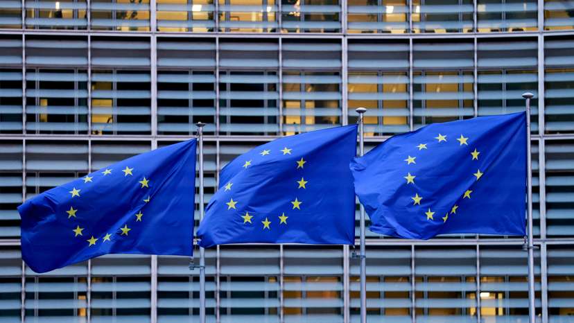 FILE PHOTO: European Union flags flutter outside the European Commission headquarters in Brussels