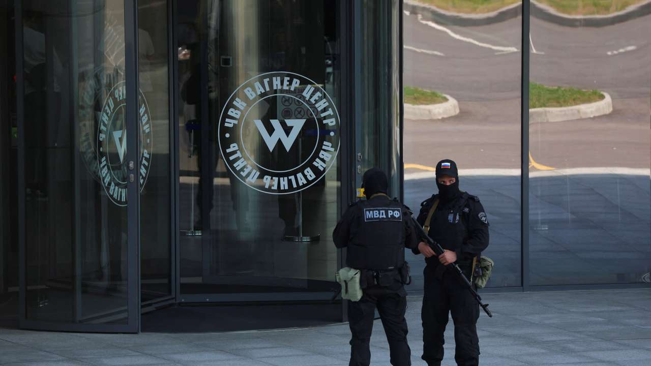 Russian law enforcement officers stand guard outside Wagner Centre in St Petersburg