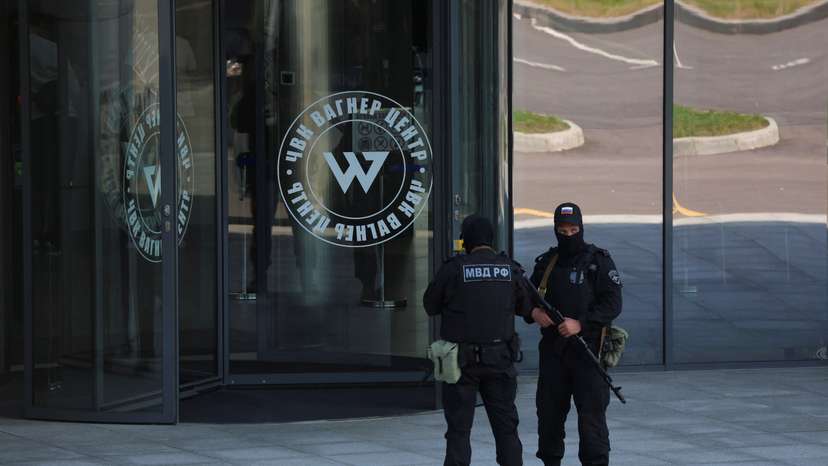 Russian law enforcement officers stand guard outside Wagner Centre in St Petersburg
