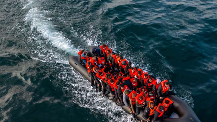 Migrants cross the English Channel in small boats