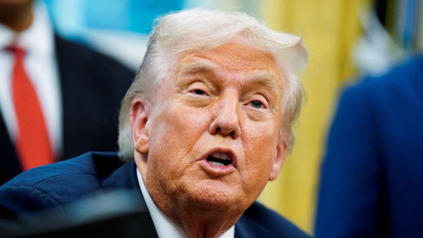 U.S. President Donald Trump signs an executive order in the Oval Office of the White House