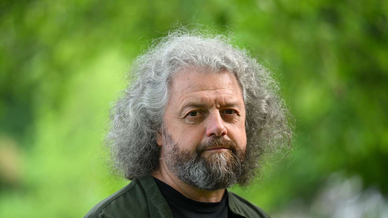 Belarusian poet and publisher Dmitri Strotsev poses for a photo in Berlin