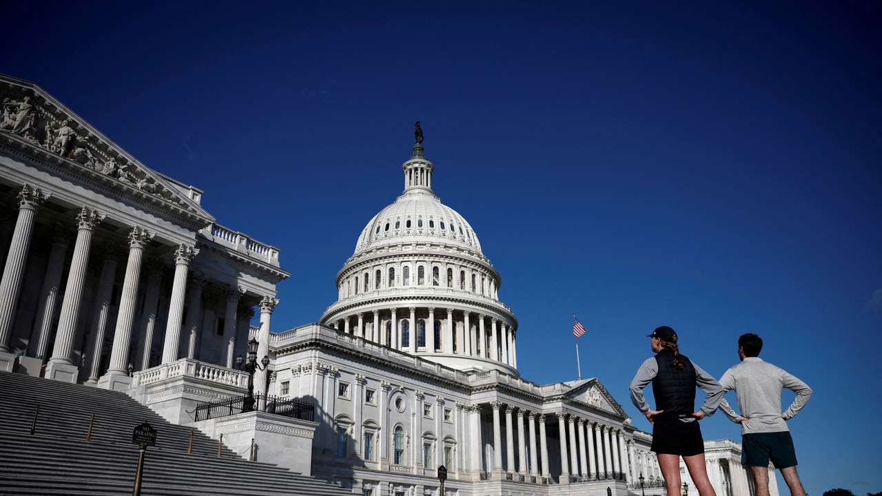 FILE PHOTO: People look the U.S. Capitol on Capitol Hill in Washington
