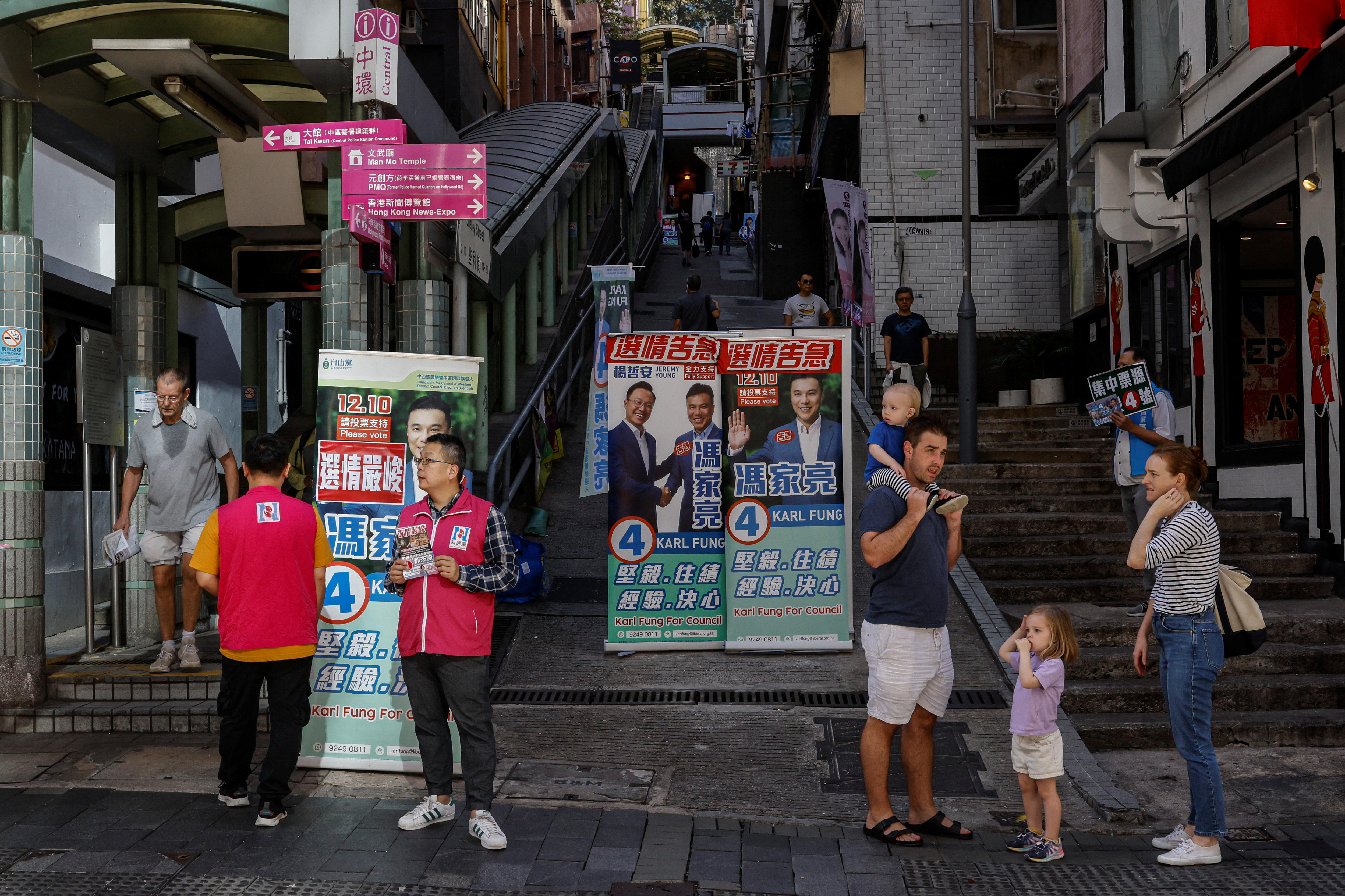 Volunteers campaign for their party during the District Council election in Hong Kong