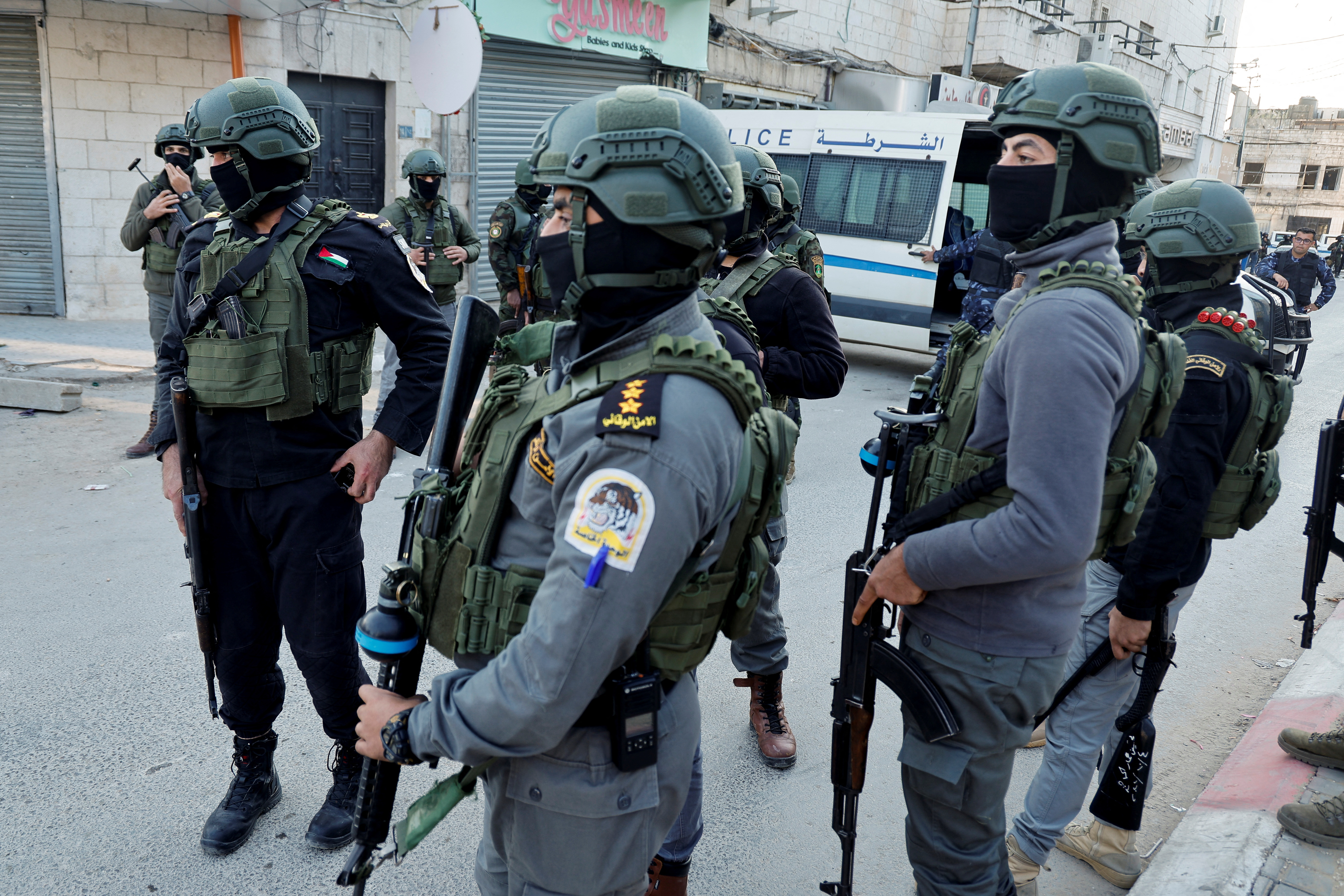 Palestinian demonstrators call for an end to clashes between Palestinian security forces and militants in Jenin