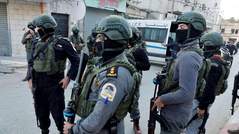 Palestinian demonstrators call for an end to clashes between Palestinian security forces and militants in Jenin