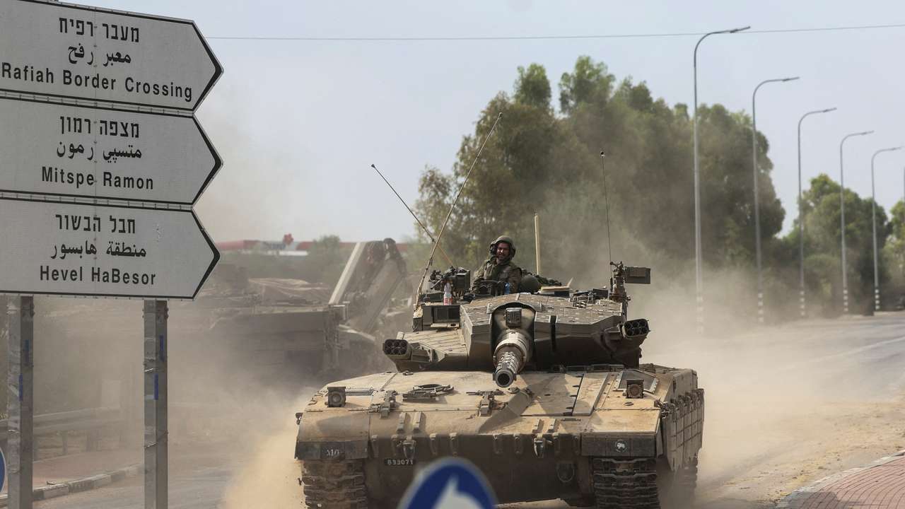 FILE PHOTO: Israeli soldiers drive in a tank by Israel's border with Gaza in southern Israel
