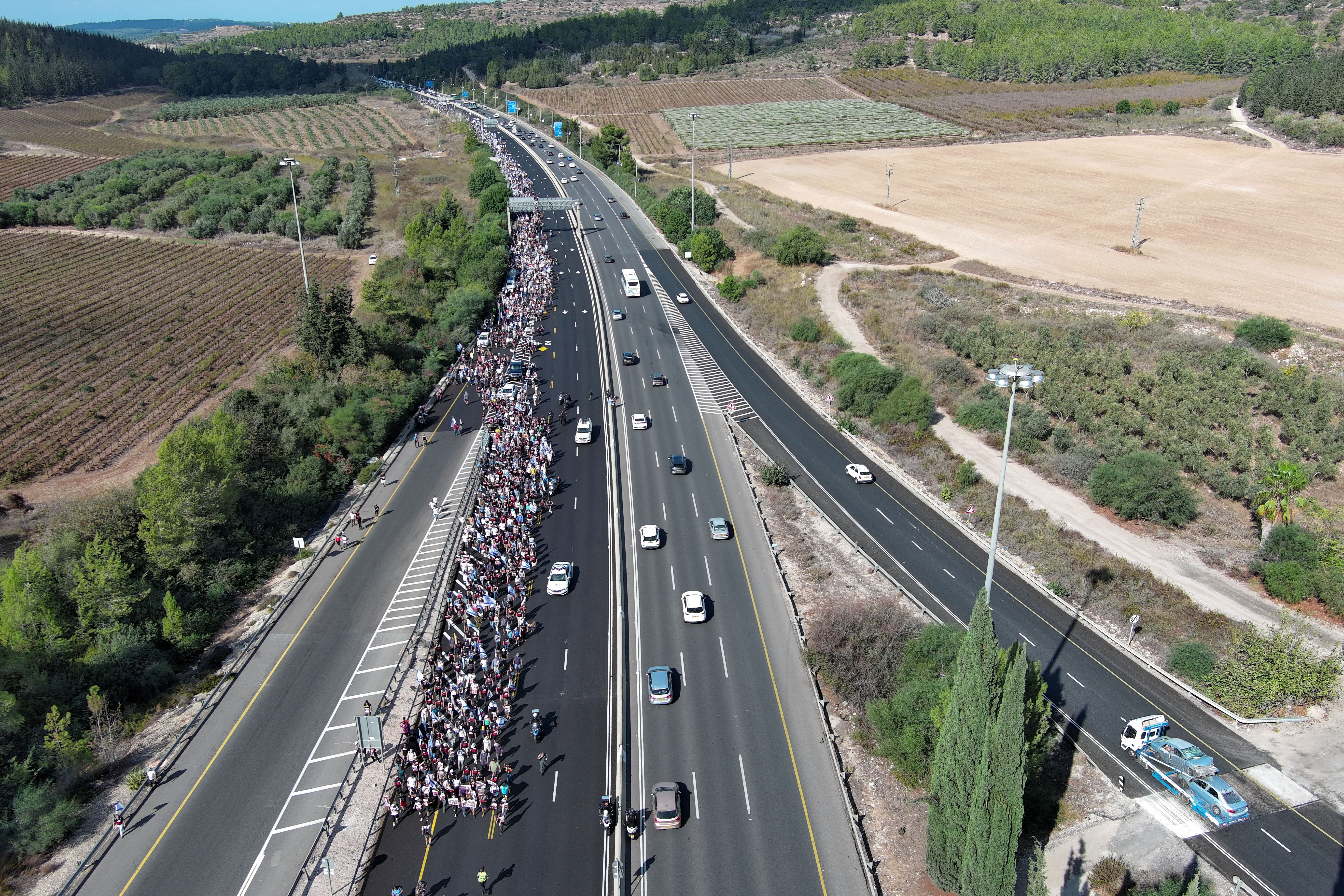 Family members, friends and supporters of Israelis and other nationalities who were taken hostage on October 7 by Palestinian Islamist group Hamas gunmen during a deadly attack, march towards Jerusalem