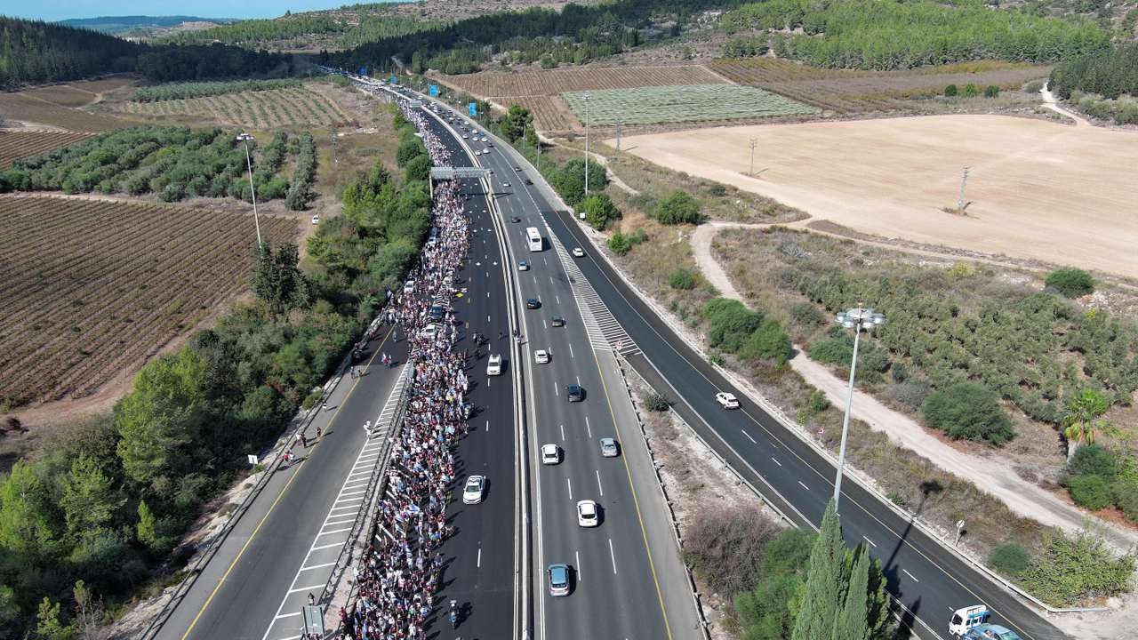 Family members, friends and supporters of Israelis and other nationalities who were taken hostage on October 7 by Palestinian Islamist group Hamas gunmen during a deadly attack, march towards Jerusalem