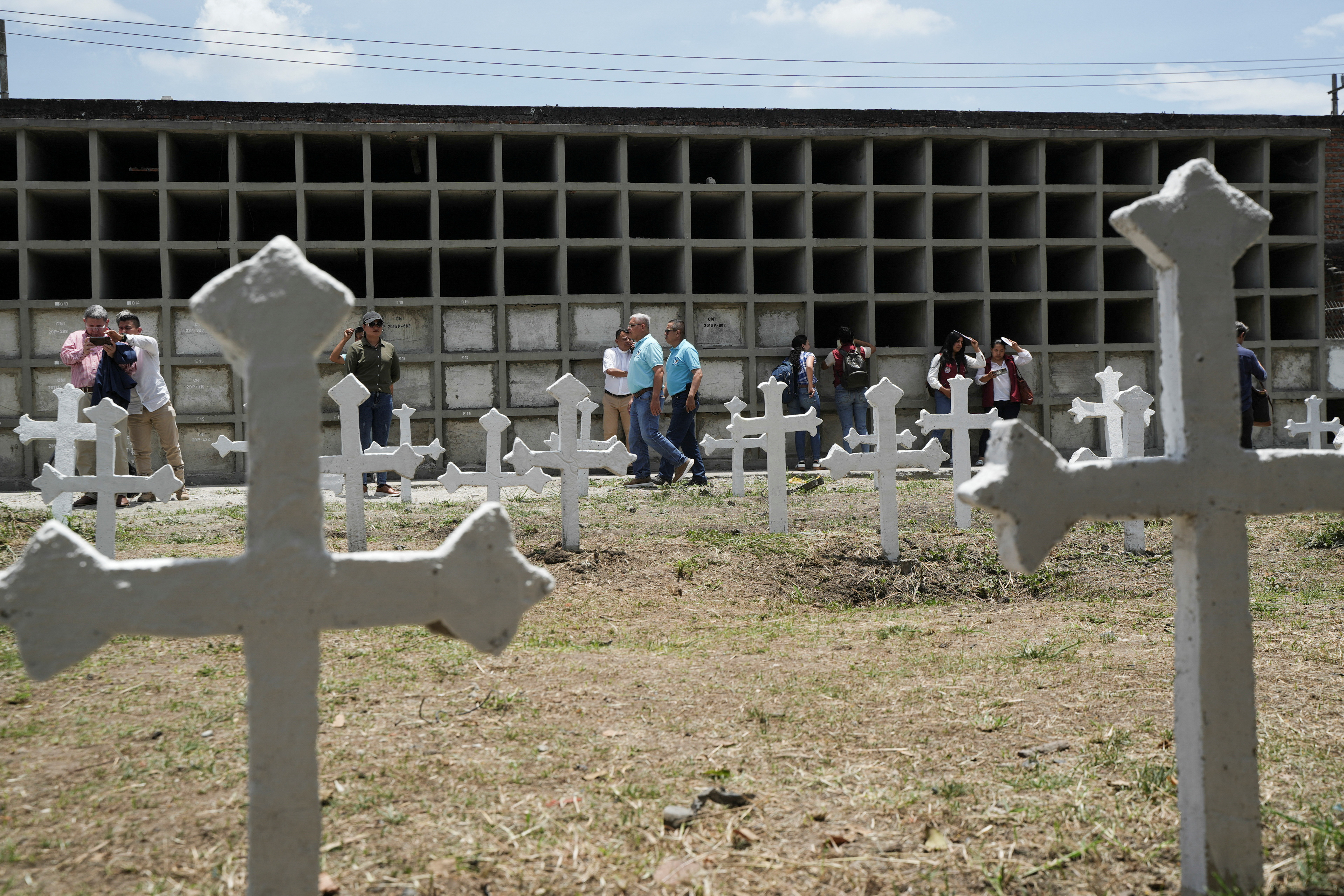 Former Colombian rebels and soldiers work together to exhume remains and give families closure