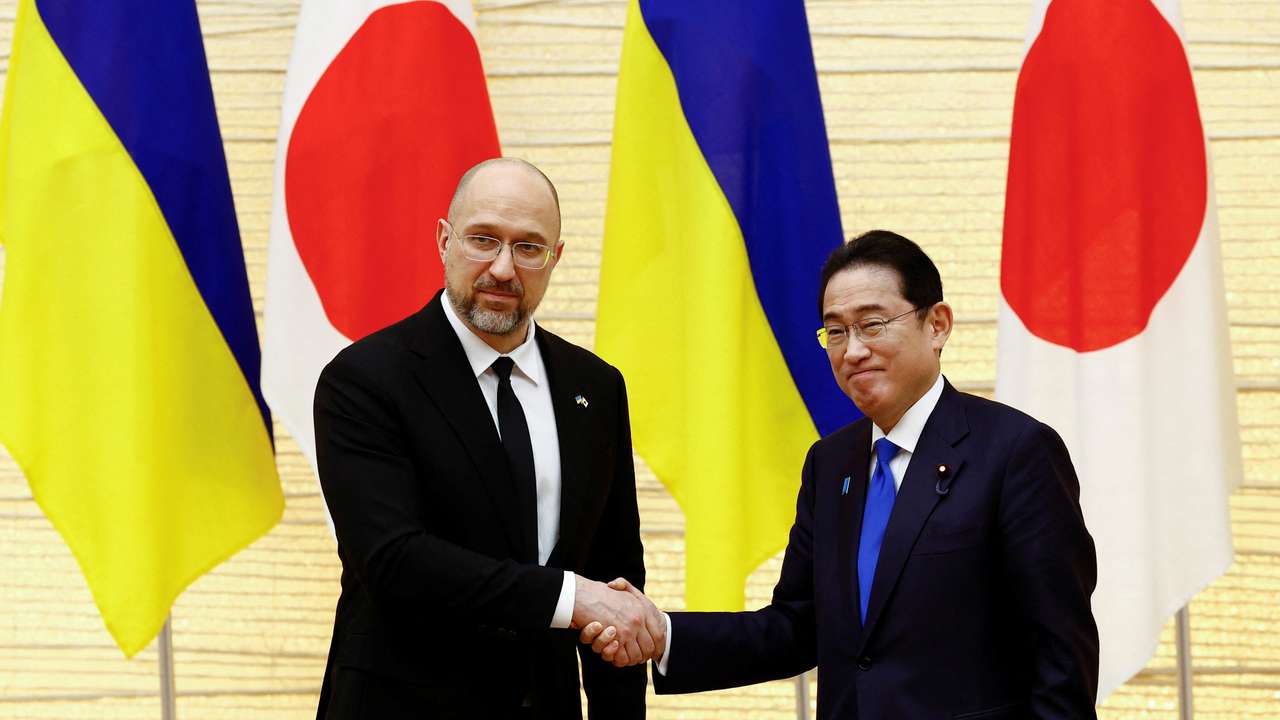 Ukraine's Prime Minister Denys Shmyhal shakes hands with Japanese Prime Minister Fumio Kishida after their joint press briefing as a part of the Japan-Ukraine Conference for Promotion of Economic Growth and Reconstruction in Tokyo