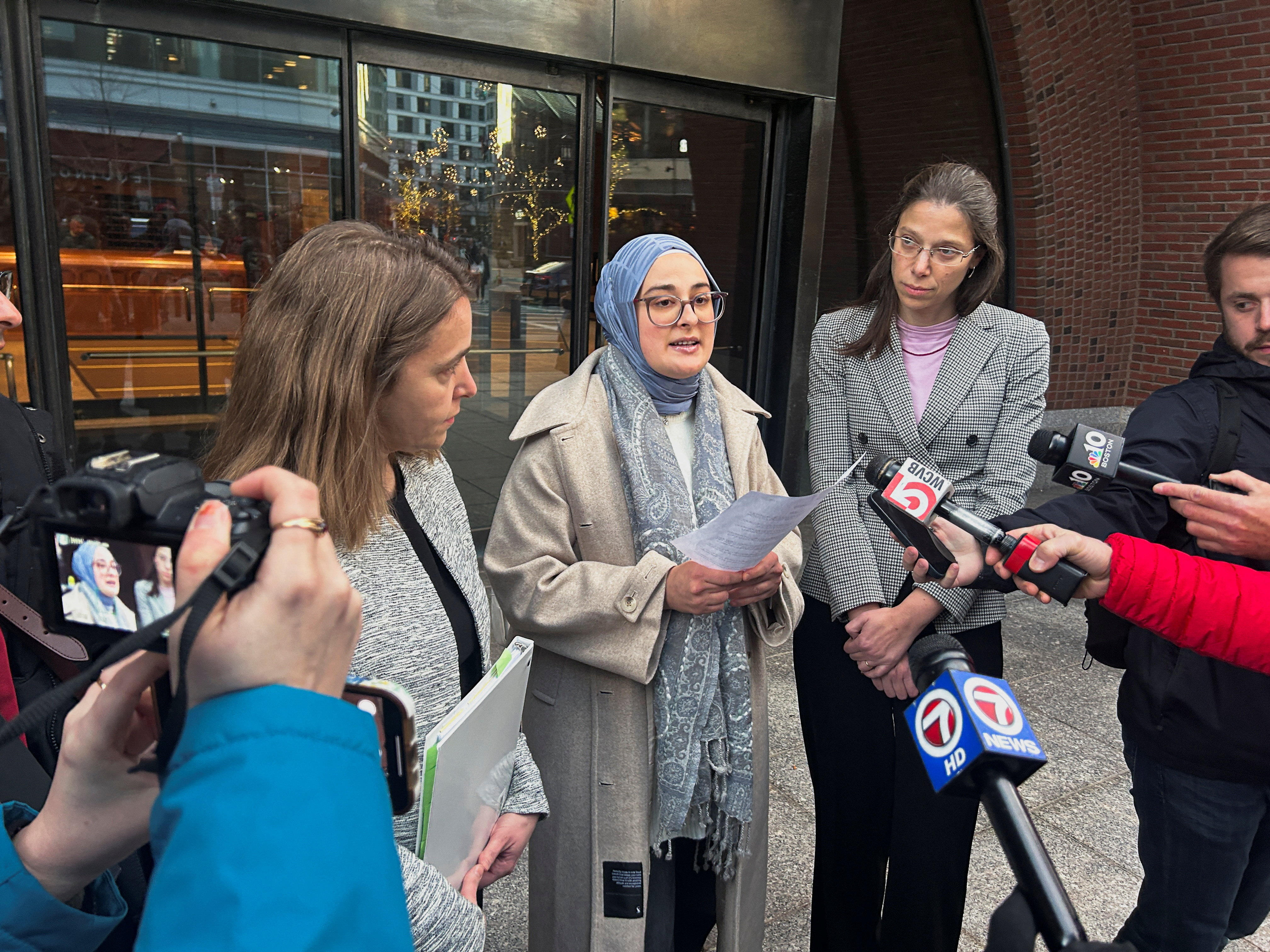 Rumeysa Ozturk, a Turkish student at Tufts University, speaks to reporters outside the federal court in Boston