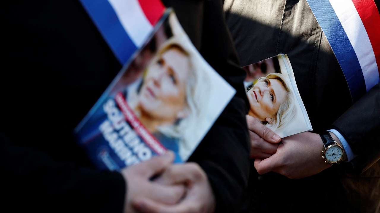 Members of the RN party distribute leaflets in support of Marine Le Pen in Henin-Beaumont