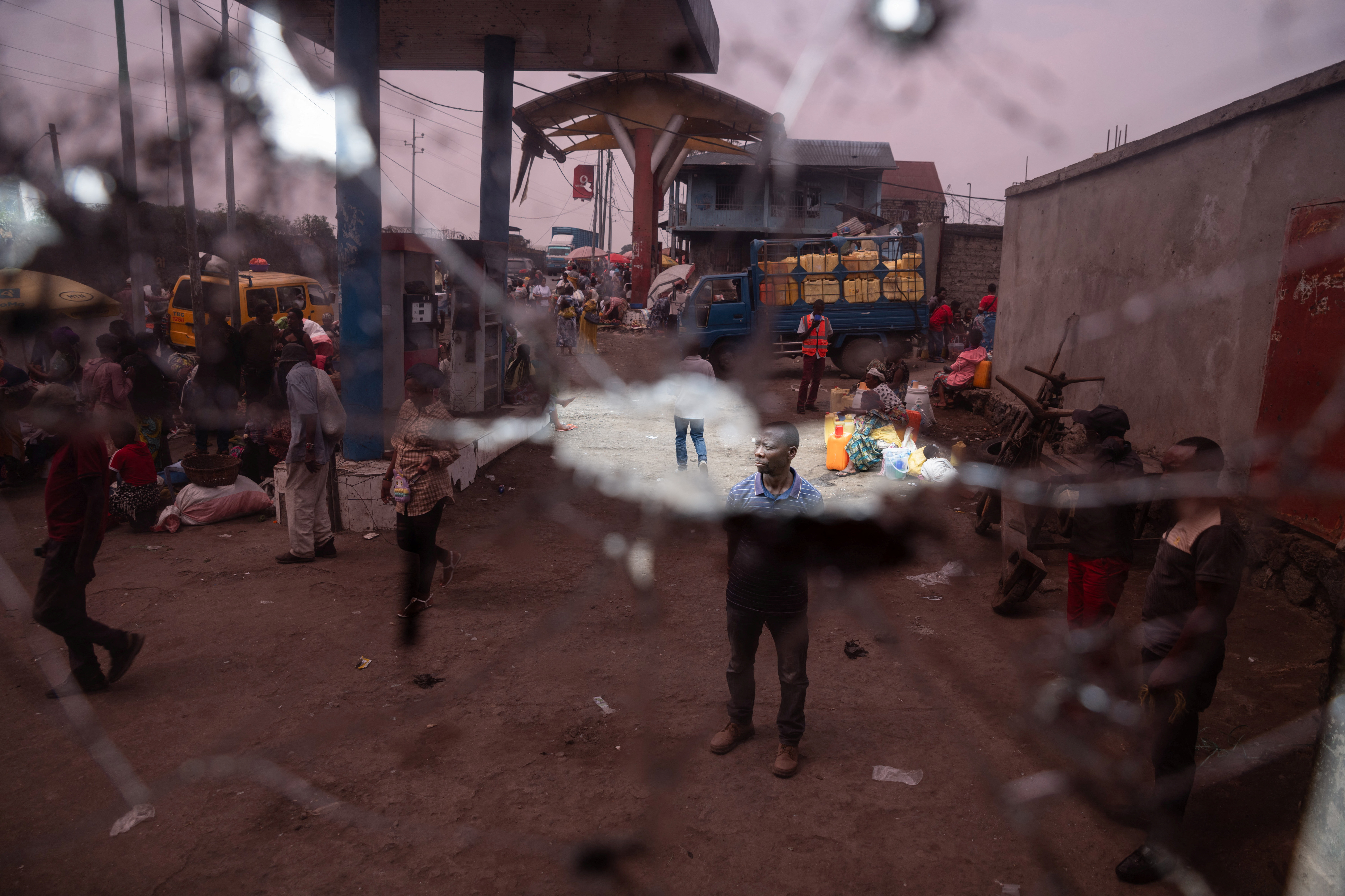Residents survey damage from fighting between M23 rebels and Congolese forces in Goma