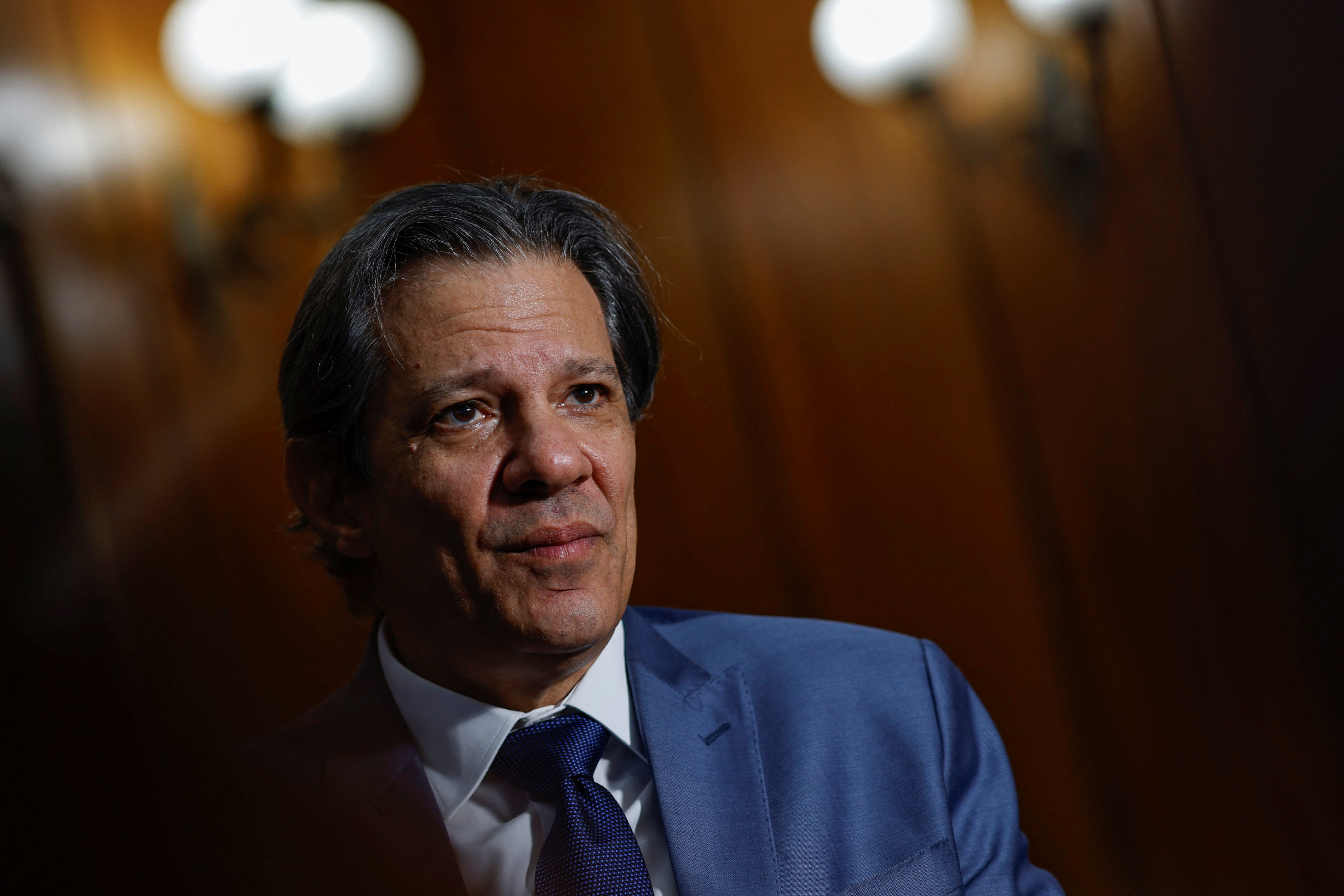FILE PHOTO: Brazil's Finance Minister Fernando Haddad attends an interview with Reuters