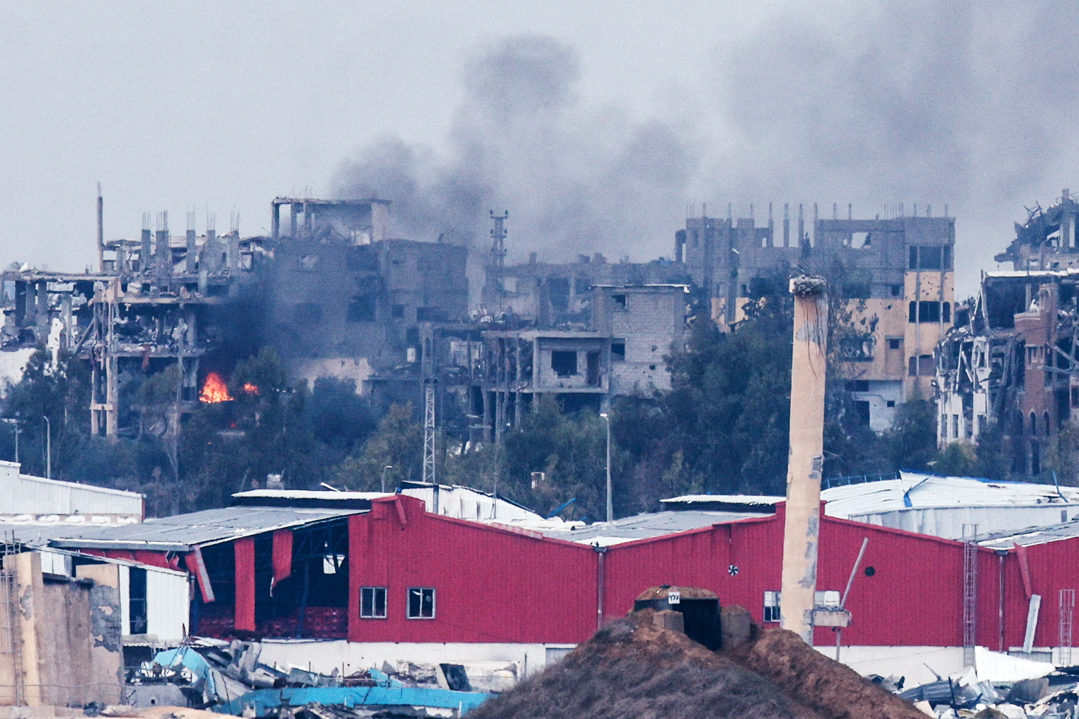 Smoke rises inside northern Gaza Strip following an airstrike, as seen from southern Israel
