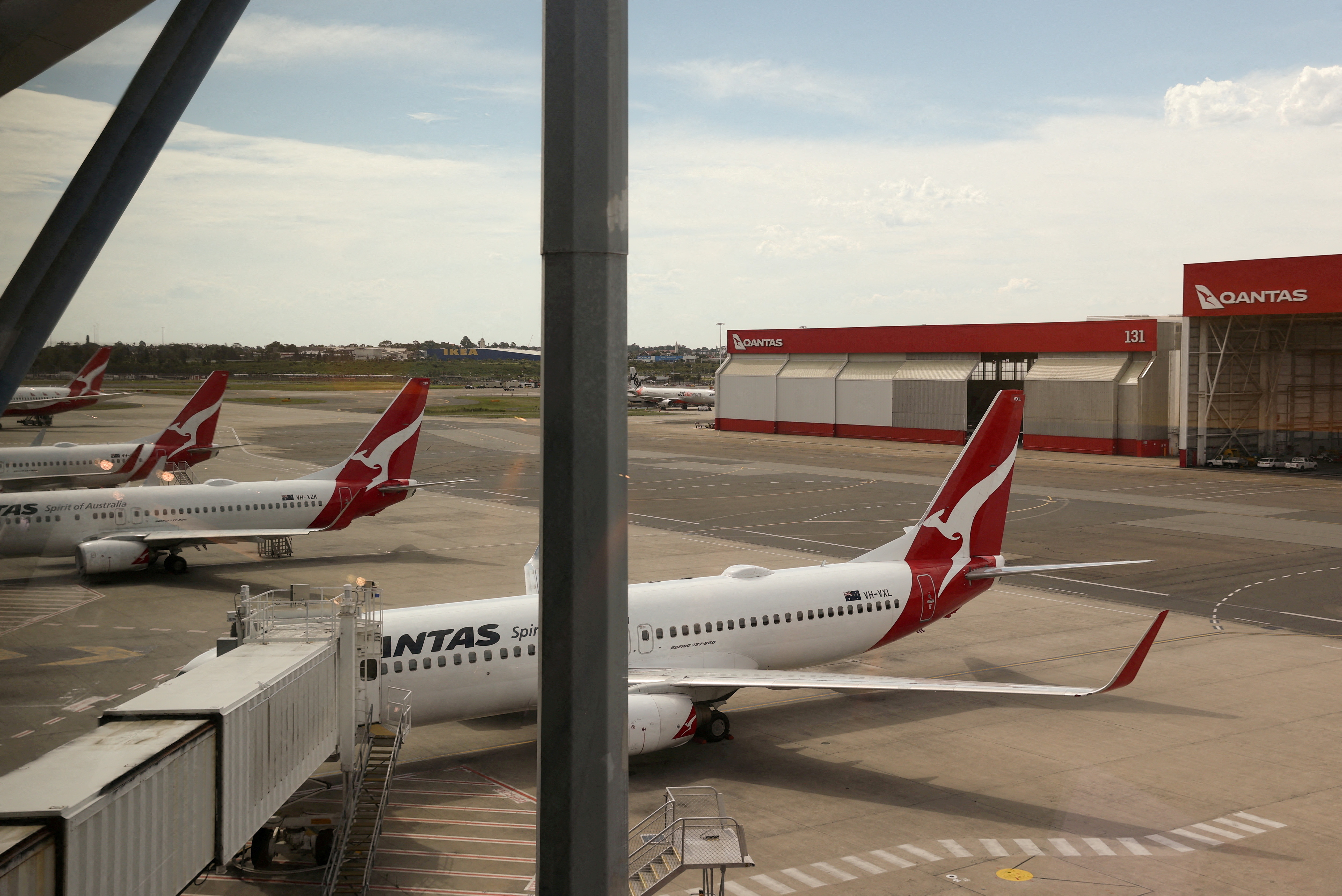 FILE PHOTO: Qantas planes are seen at a domestic terminal at Sydney Airport in Sydney