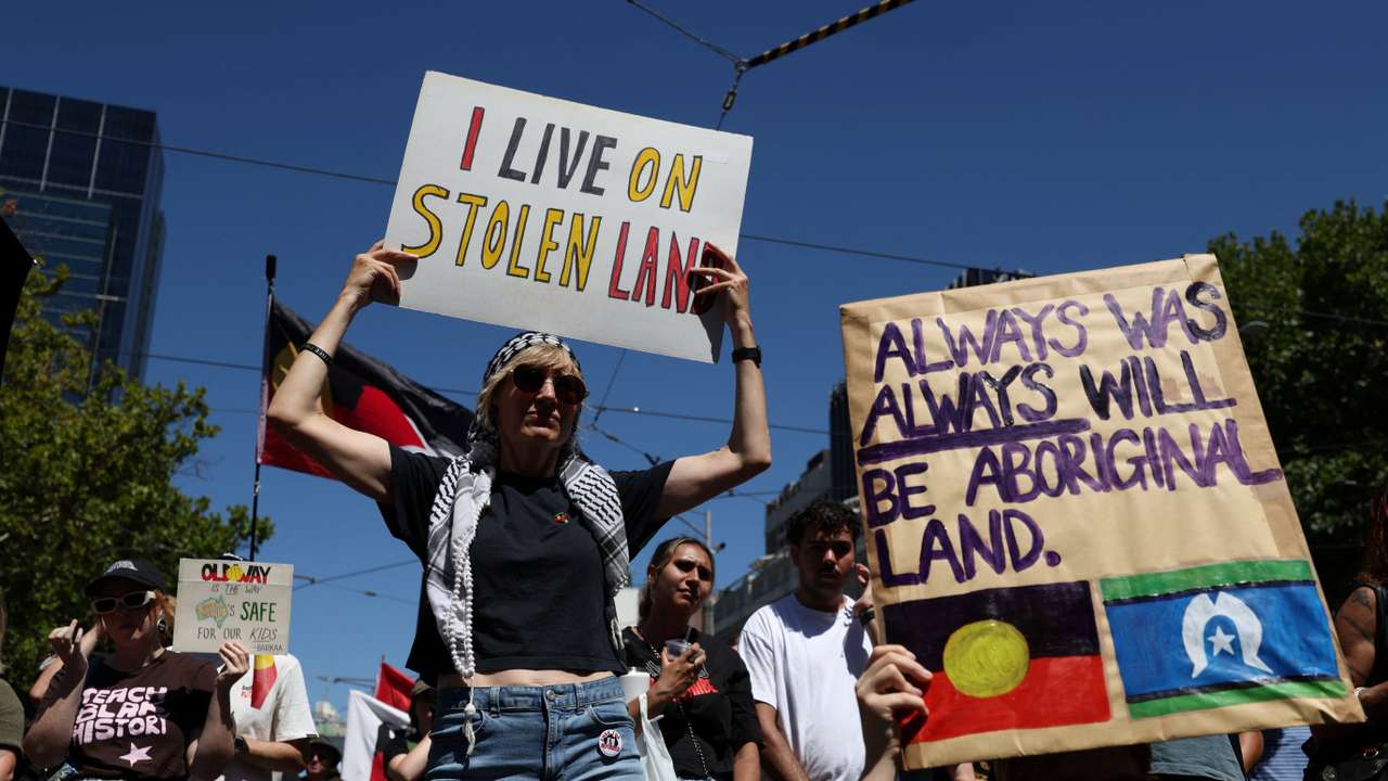 Protestors attend an "Invasion Day" rally on Australia Day, in Melbourne