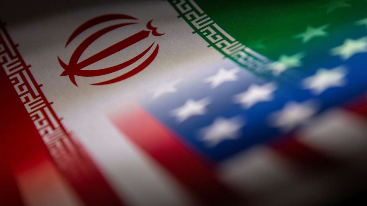 Illustration shows Iran's and U.S.' flags