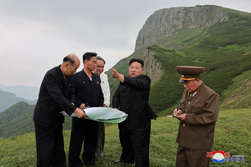 FILE PHOTO: North Korean leader Kim Jong Un guides the Samjiyon City construction project