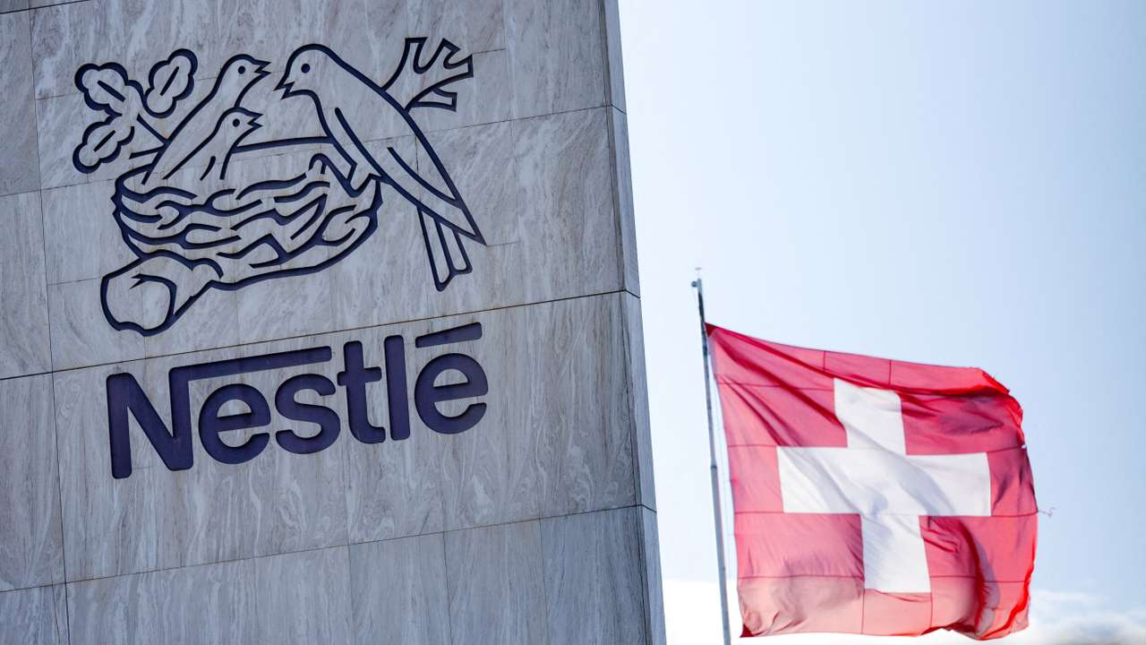 FILE PHOTO: A Swiss flag flutters on the headquarters of Nestle in Vevey