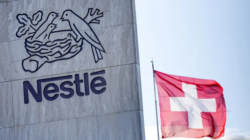 FILE PHOTO: A Swiss flag flutters on the headquarters of Nestle in Vevey