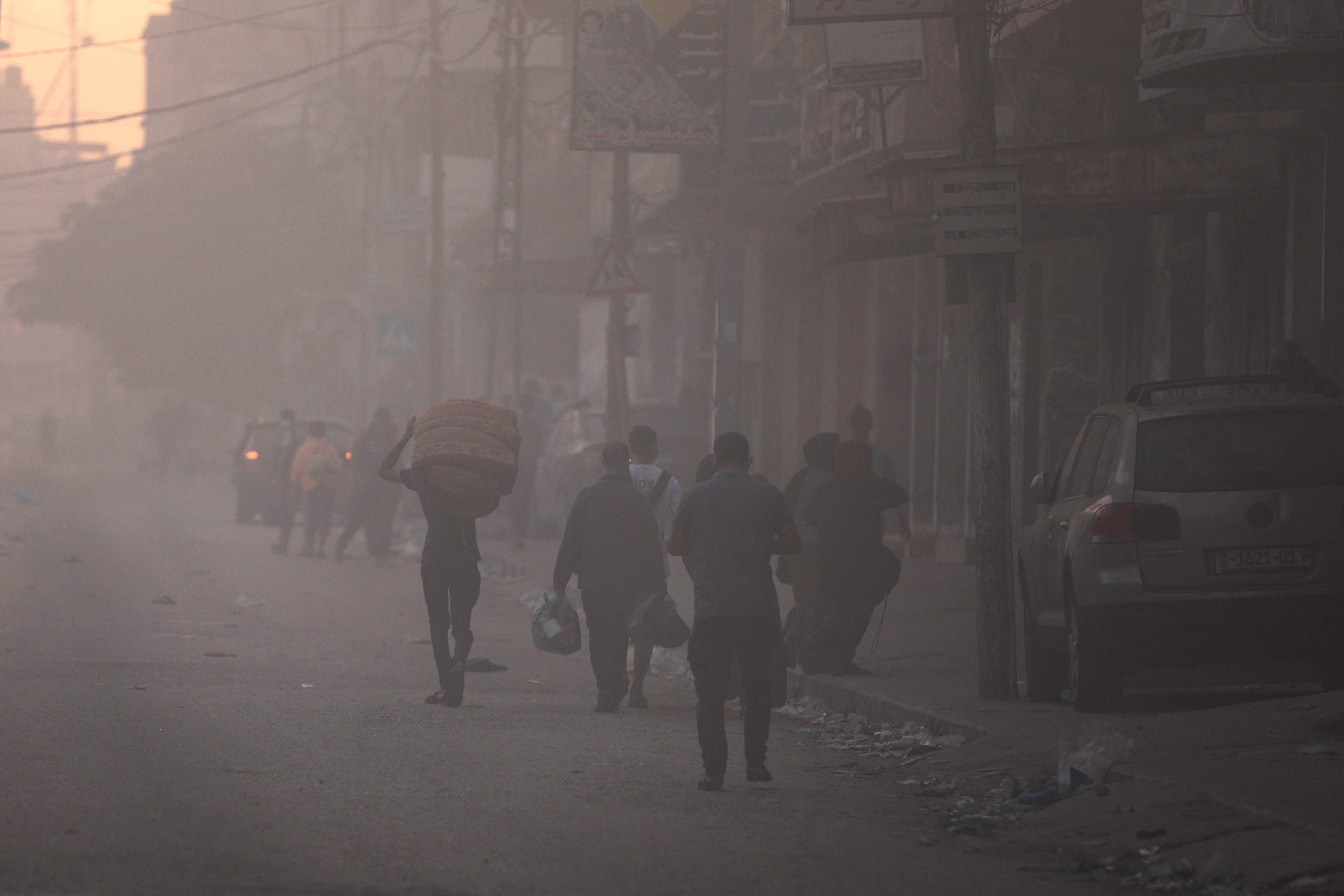 Palestinians flee their homes during Israel's ground offensive, in Gaza City