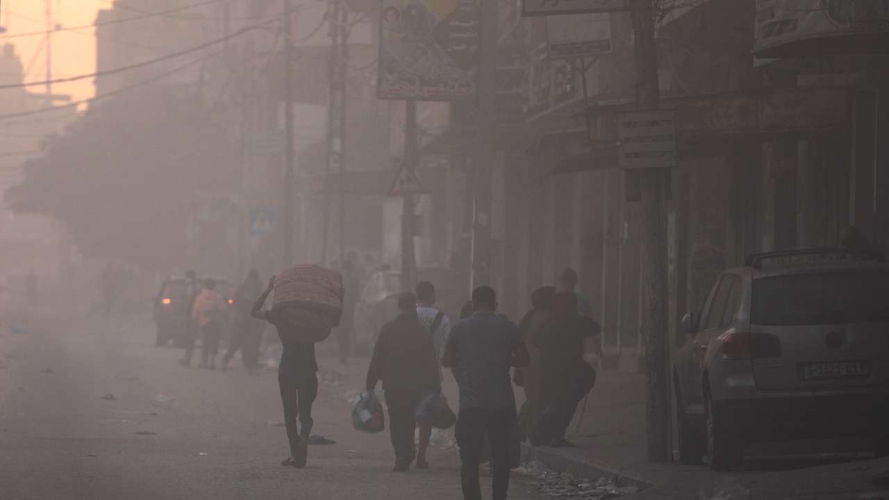 Palestinians flee their homes during Israel's ground offensive, in Gaza City