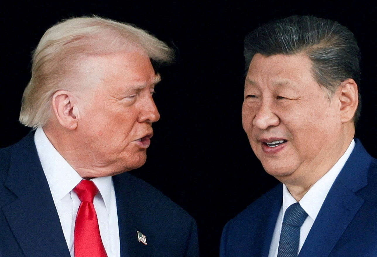 FILE PHOTO: U.S. President Donald Trump meets with Chinese President Xi Jinping on the sidelines of the APEC summit, in Busan
