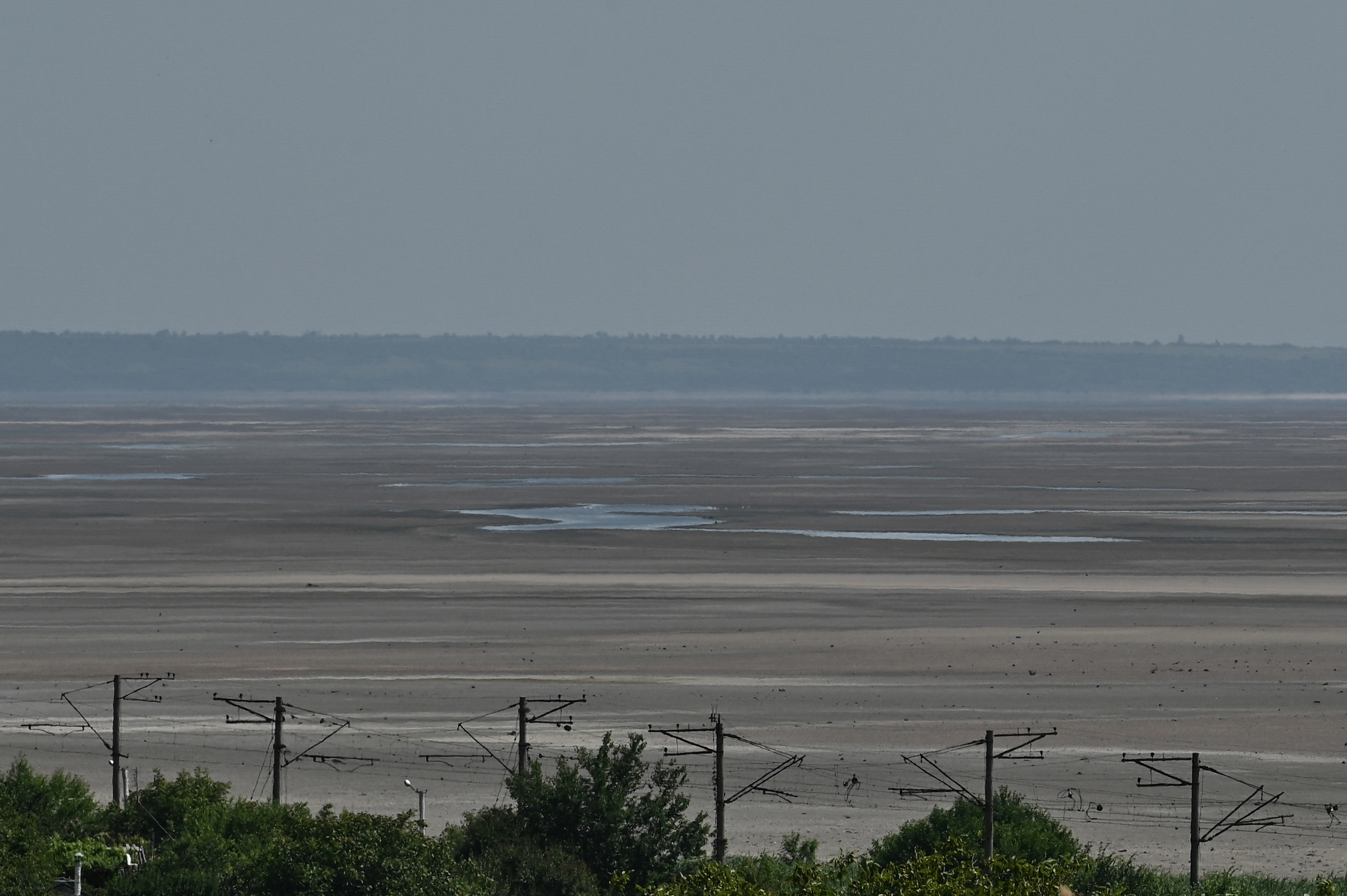 FILE PHOTO: View shows the dried-up Dnipro river bank after water level sharply dropped following Kakhovka dam destruction, in Zaporizhzhia region