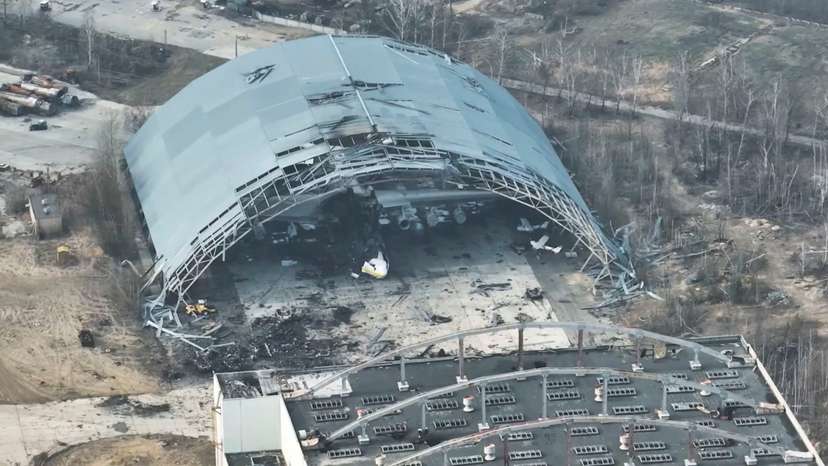 A damaged aircraft is seen in a destroyed hangar at the Antonov International Airport, near Hostomel