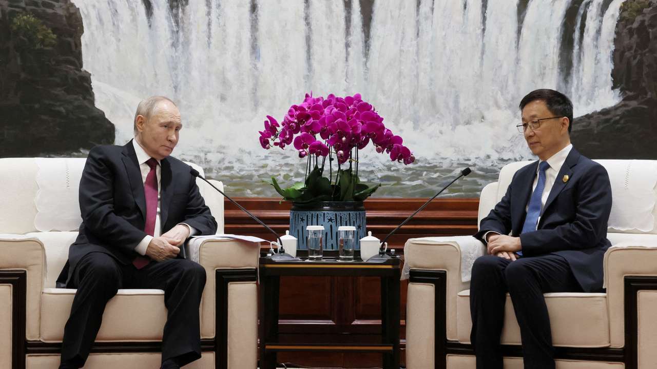 FILE PHOTO: Russian President Vladimir Putin and Chinese Vice President Han Zheng meet in Harbin