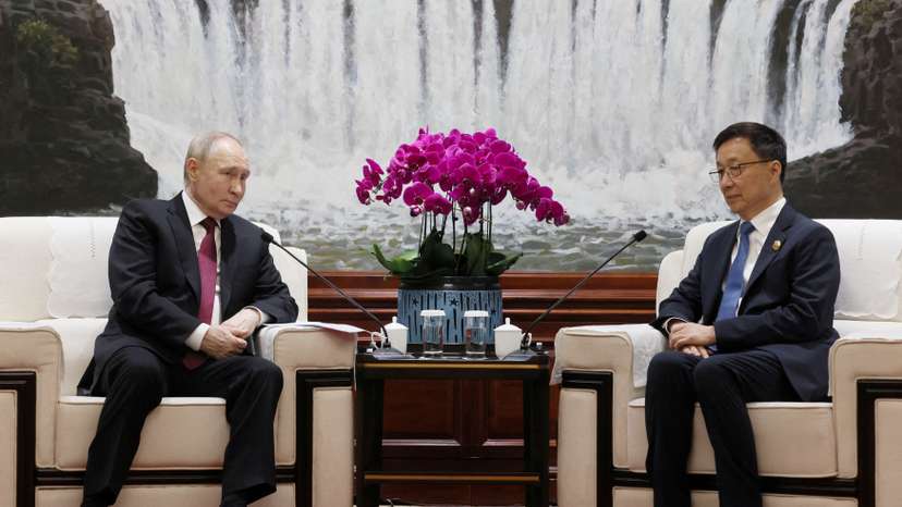 FILE PHOTO: Russian President Vladimir Putin and Chinese Vice President Han Zheng meet in Harbin