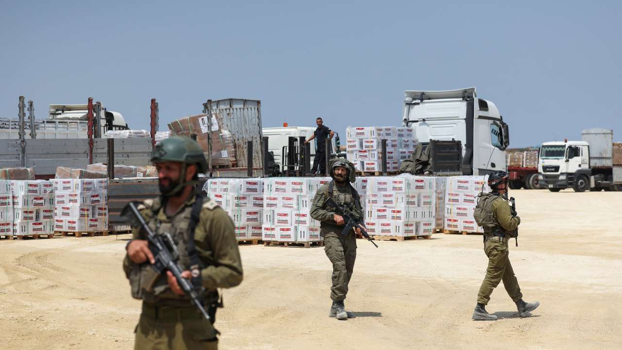Israeli soldiers secure humanitarian aid near Erez Crossing in northern Gaza