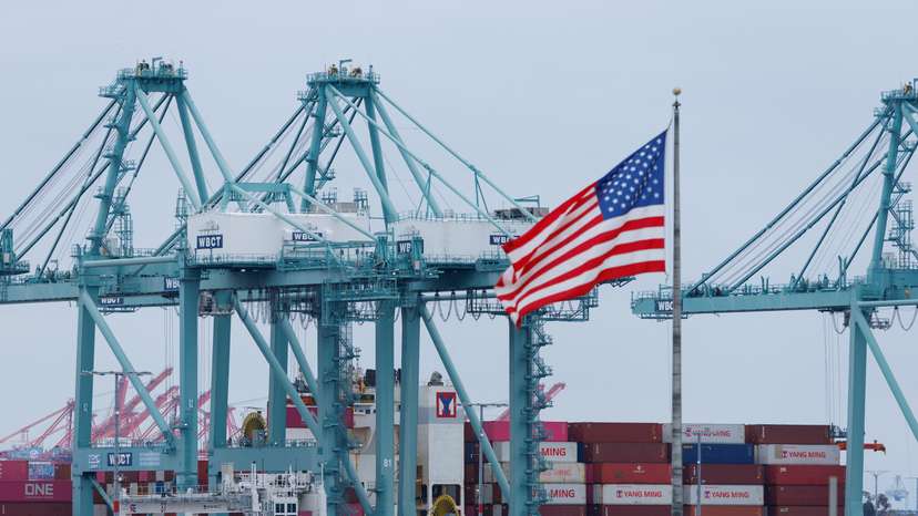 Shipping containers are unloaded at the Port of Los Angeles, in San Pedro