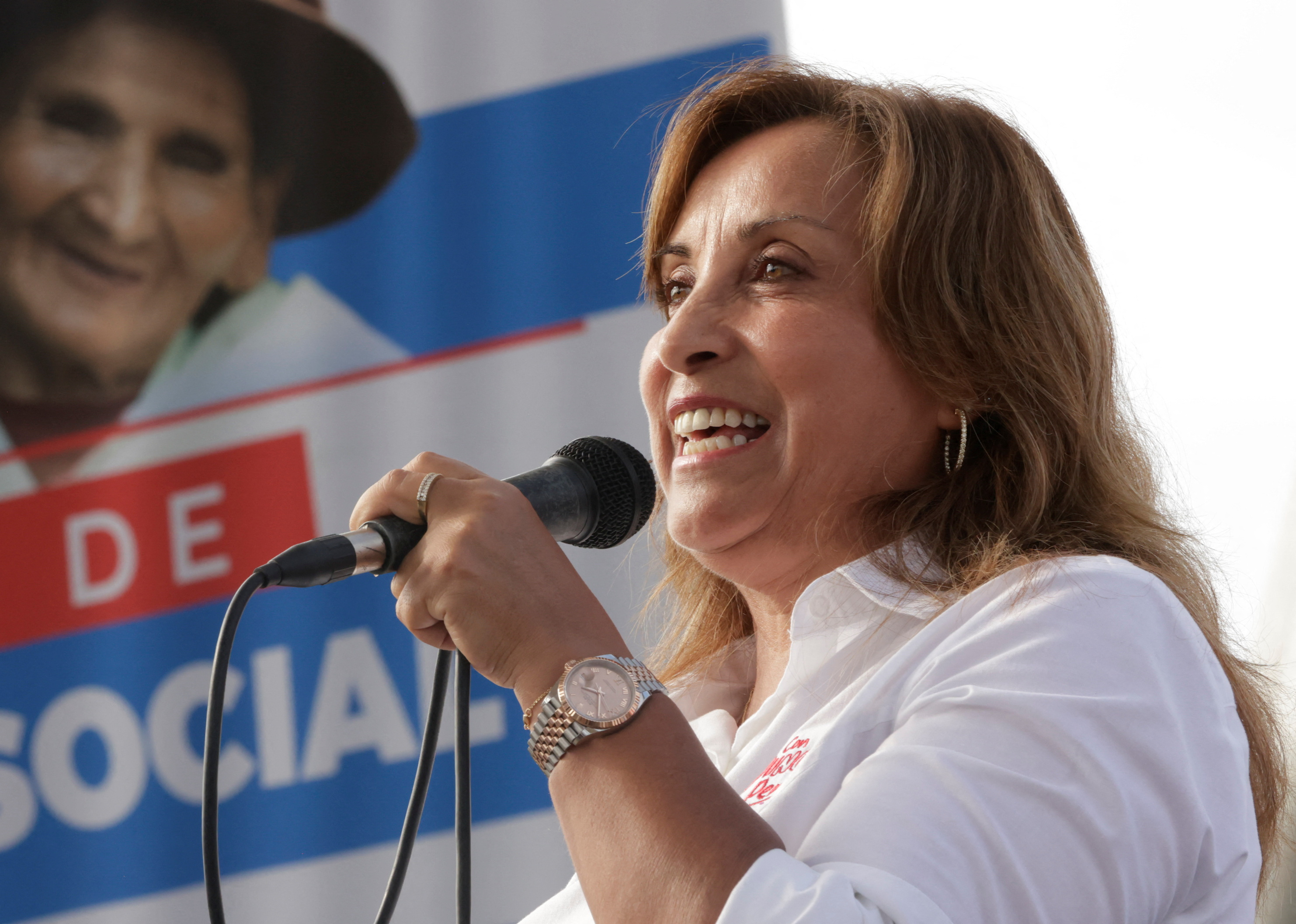 Peru's President Dina Boluarte addresses the audience during an assistance program for the elderly