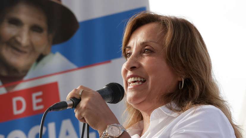 Peru's President Dina Boluarte addresses the audience during an assistance program for the elderly