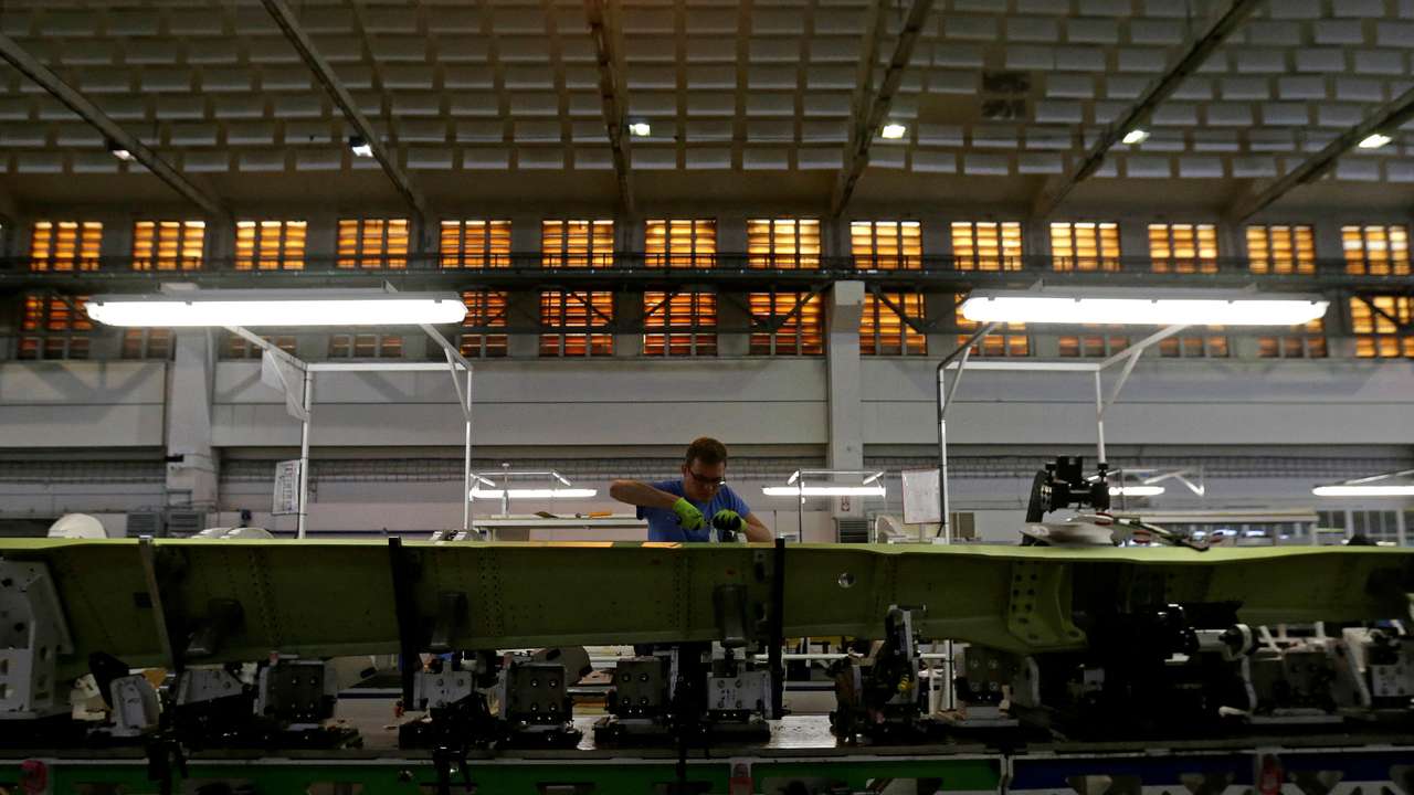 FILE PHOTO: An employee works on the assembly line in a hangar of an aircraft manufacturer Aero Vodochody near the town of Odolena Voda
