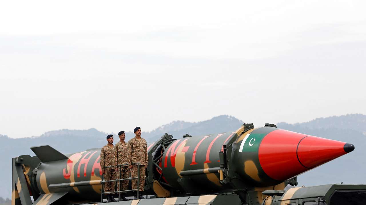 FILE PHOTO: Pakistani military personnel stand beside a Shaheen III surface-to-surface ballistic missile during Pakistan Day military parade in Islamabad