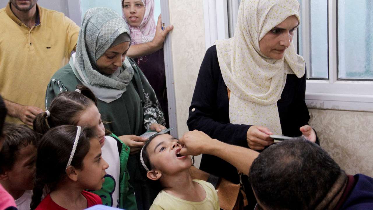 FILE PHOTO: Palestinian children are vaccinated against polio, in Jabalia