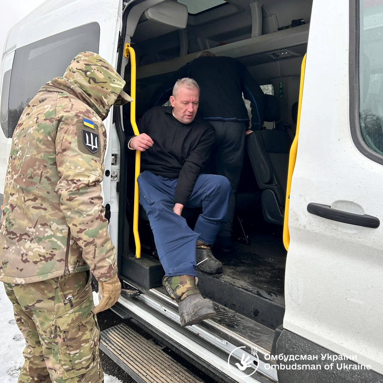 Ukrainian POWs are seen after a swap at an unknown location in Ukraine