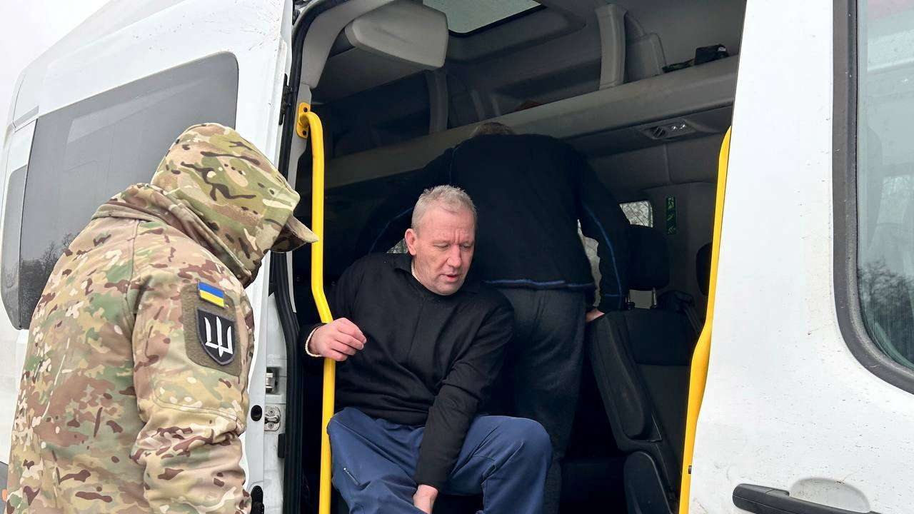 Ukrainian POWs are seen after a swap at an unknown location in Ukraine