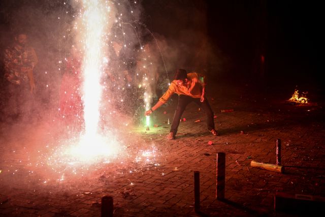 Despite bans, firecrackers sizzle across India for Diwali