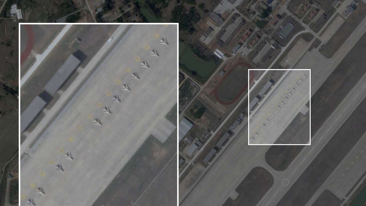 A satellite image shows obsolete J-6 fighters that have been converted into attack drones, lined up next to the runway at Longtian airbase in China's Fujian Province