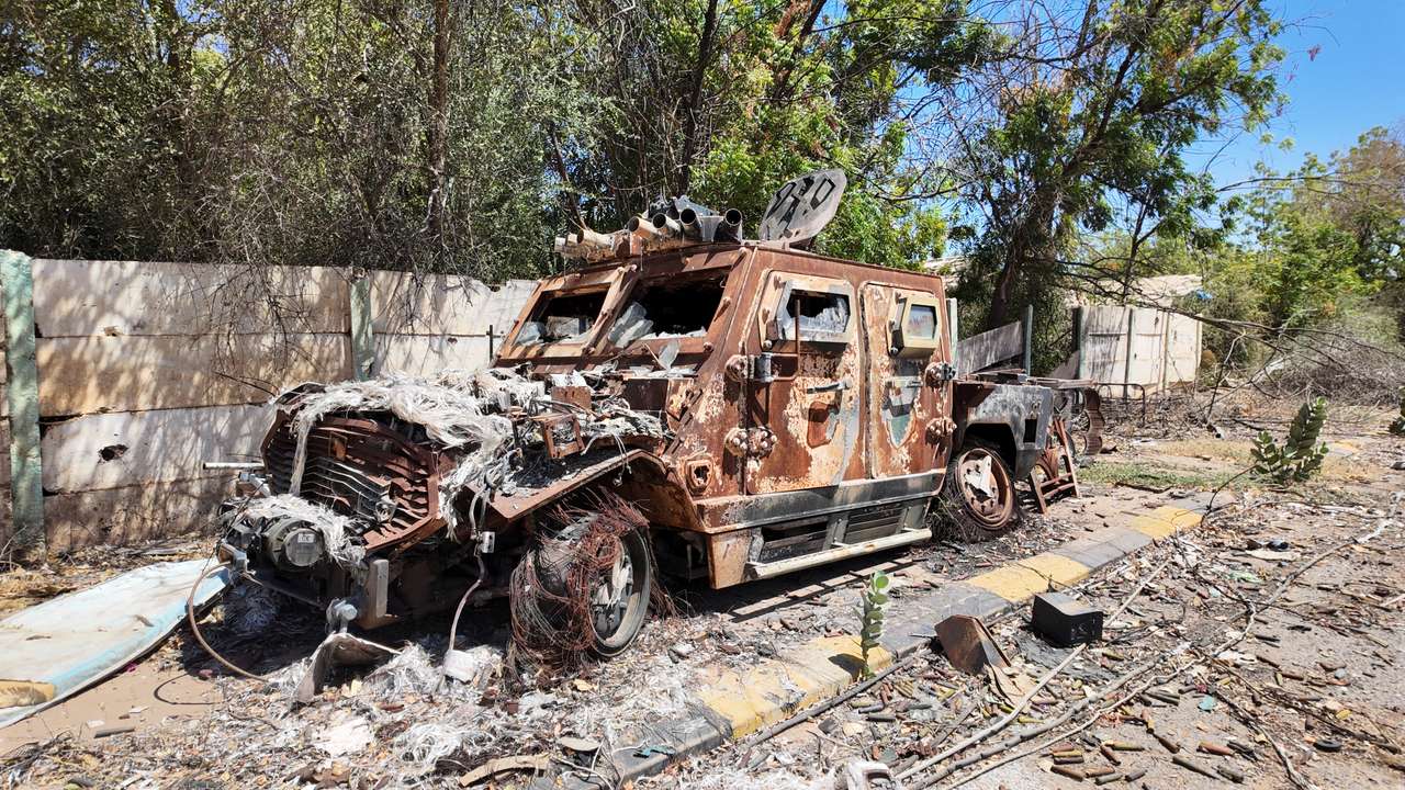 A destroyed military vehicle stands after a battle between members of the Sudanese army and the Rapid Support Forces (RSF) in the capital Khartoum