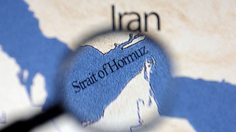 Illustration shows map showing the Strait of Hormuz and Iran