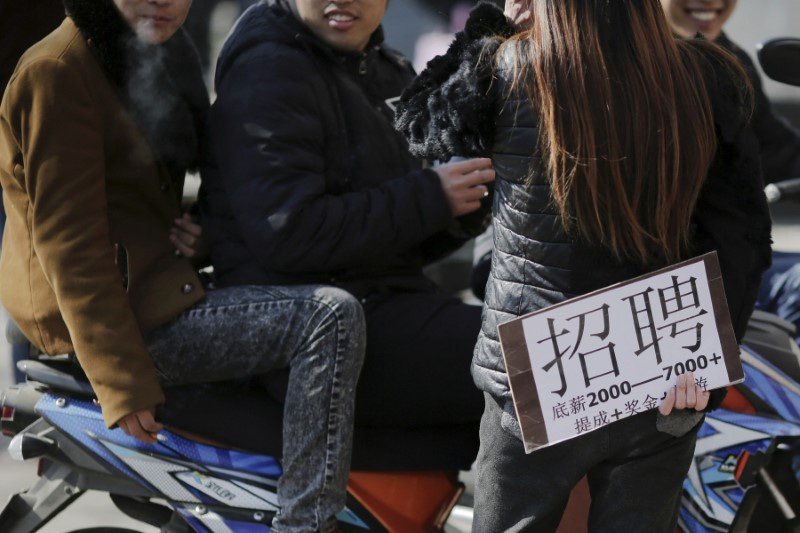 FILE PHOTO: Spotlight:China's youth face job uncertainty